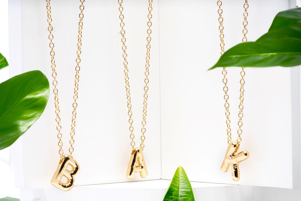 Picture of gold chunky bold letter initial necklace - M