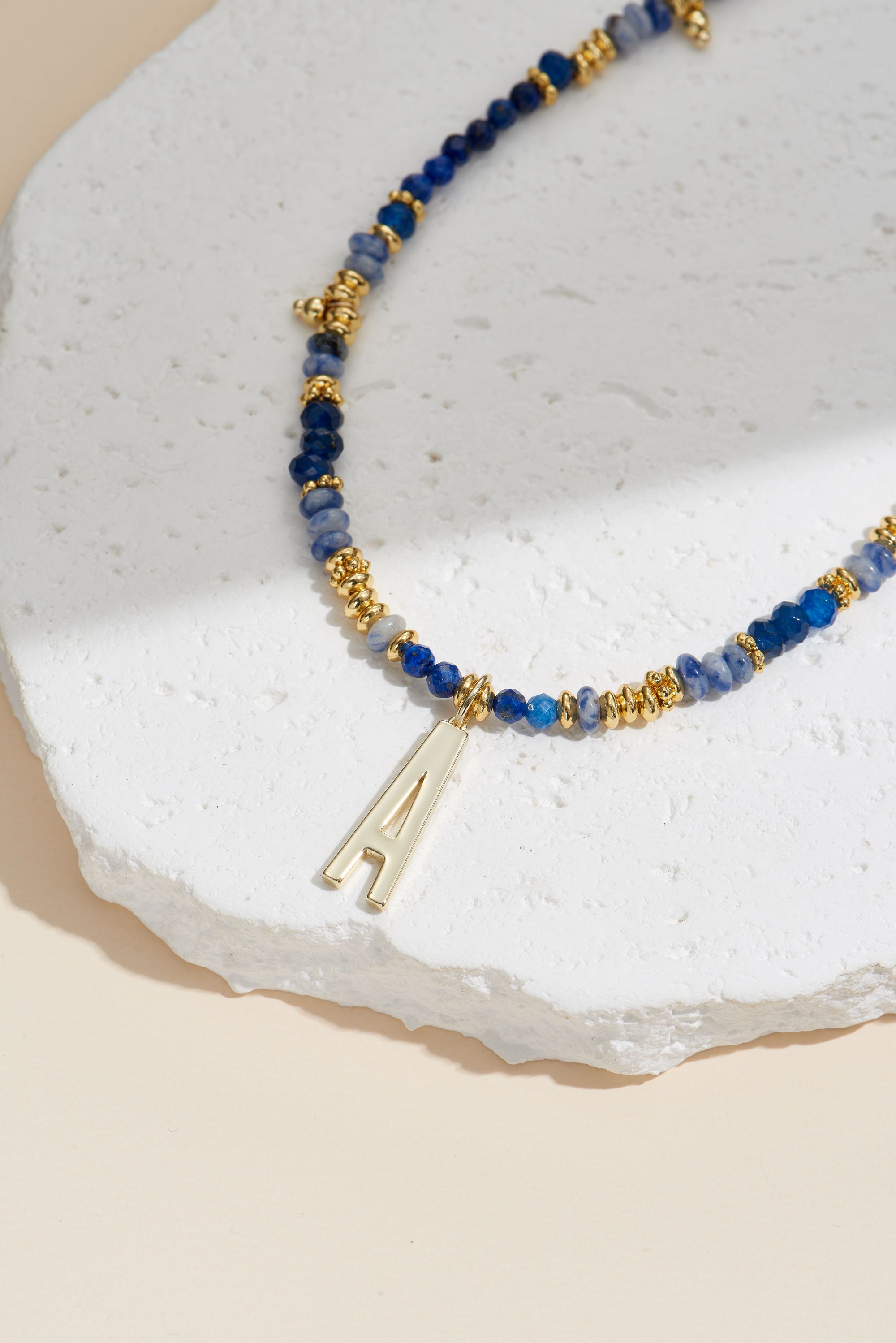 Picture of 26pc gold lapis rock your letter initial necklace