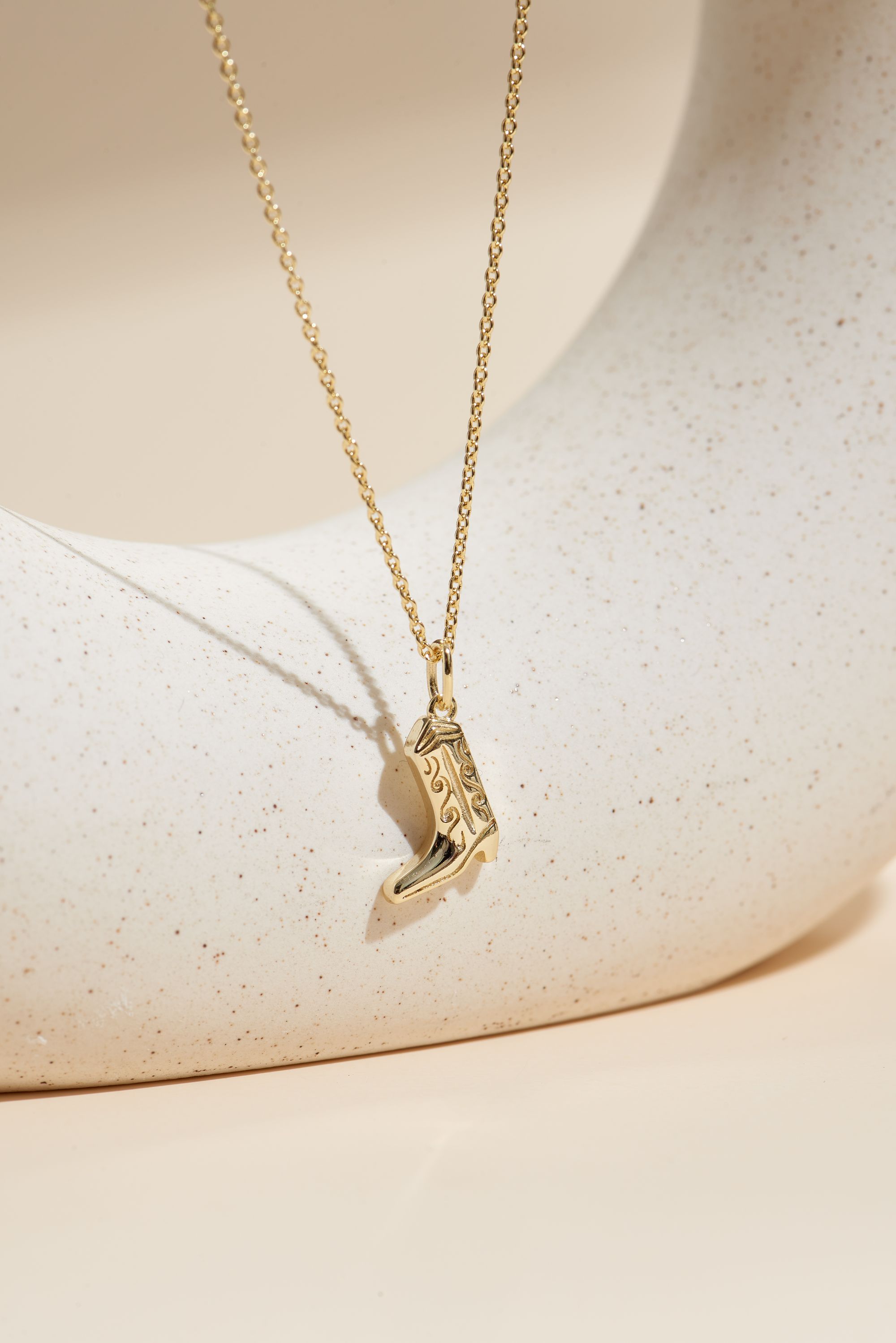 Picture of gold wish and wonder cowboy boot necklace