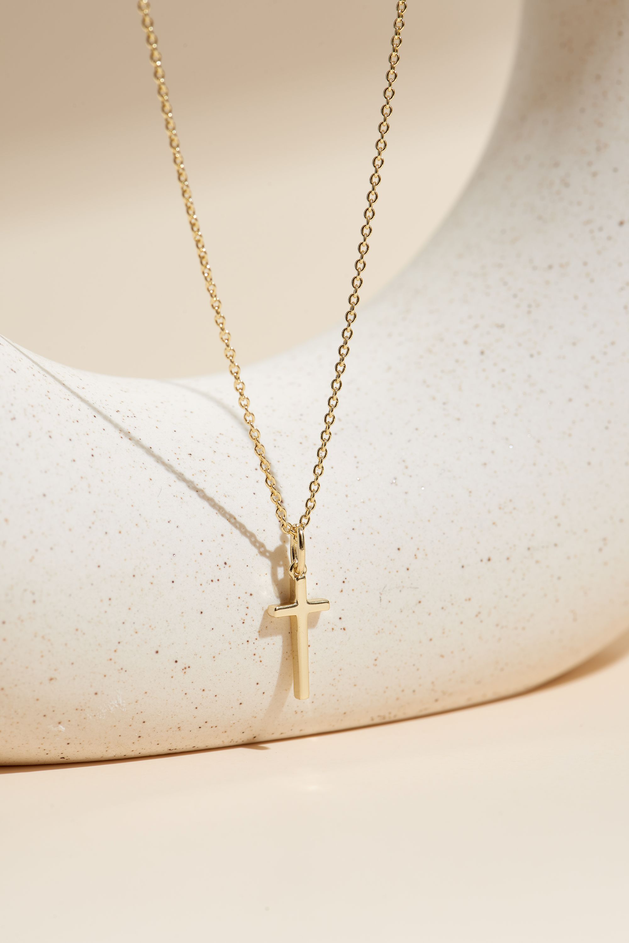 Picture of gold wish and wonder cross necklace