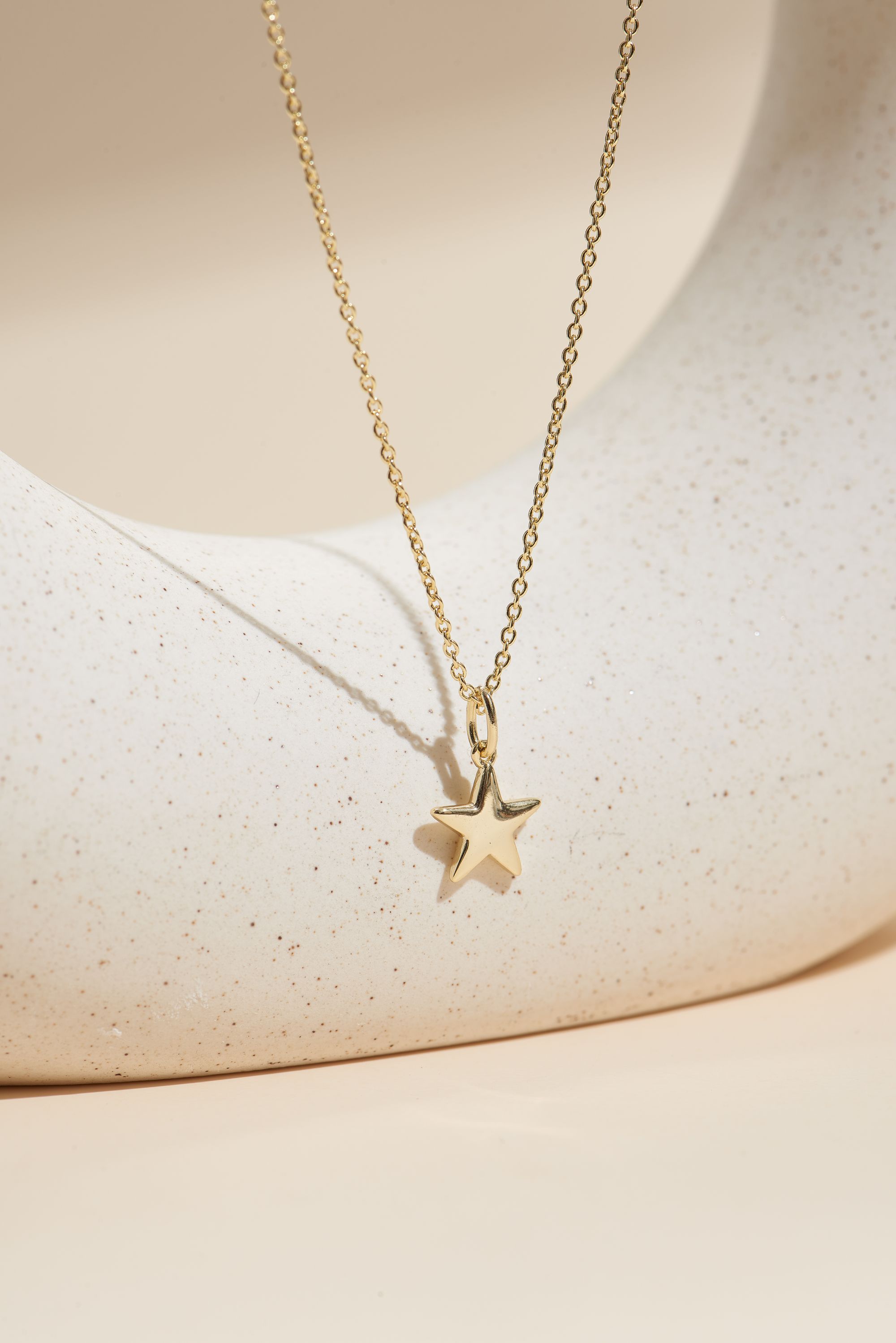 Picture of gold wish and wonder star necklace