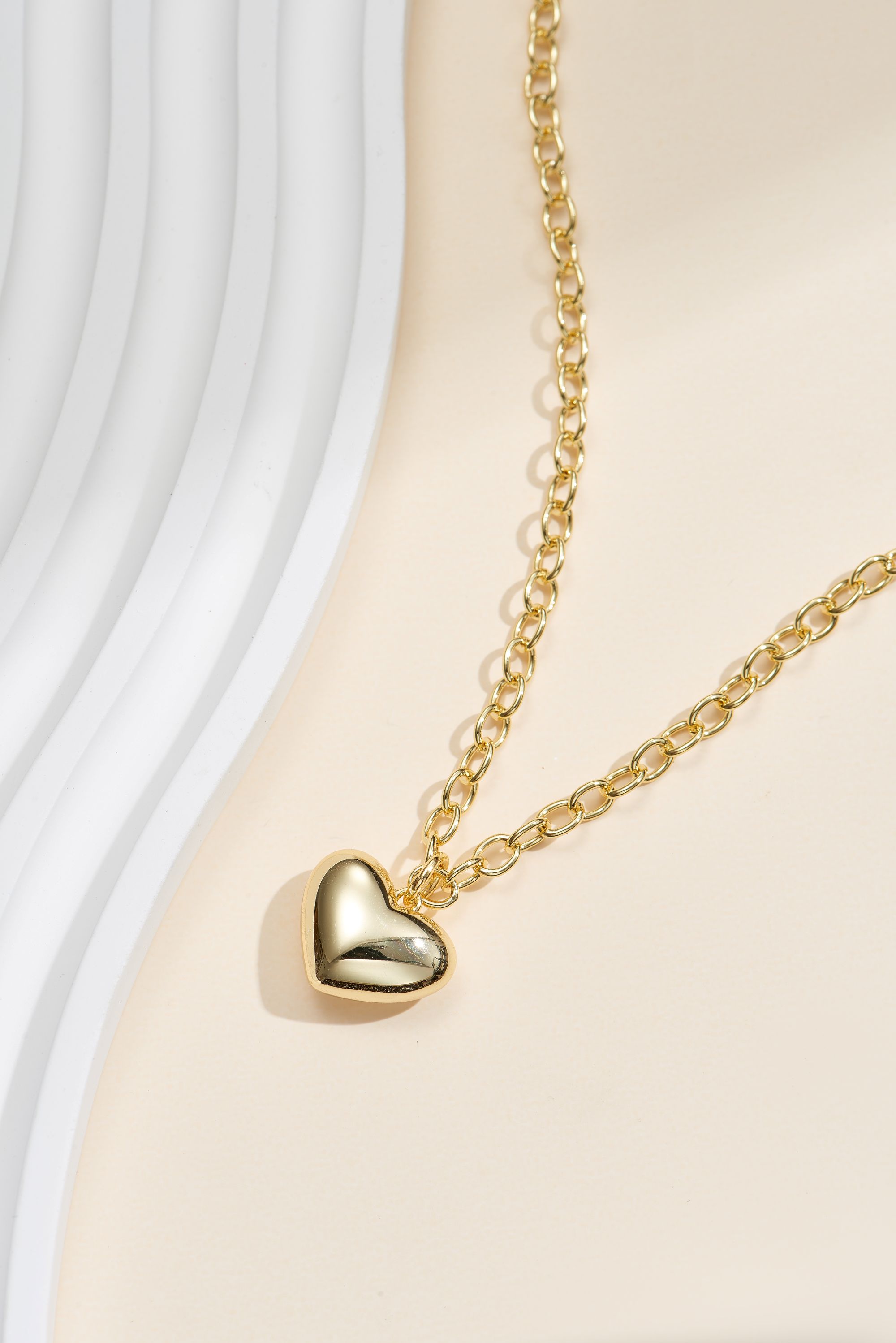 Picture of gold wish and wonder puffy heart necklace
